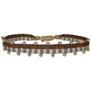   This beautiful hadmade bracelet has been handwoven in Colombia by our team of artisans using Polyester threads in burgundy tones with 14k gold filled beads.  This can be worn solo or with your favourite pieces.  Details:      Polyester threads     14k gold filled beads     Handwoven adjustable bracelet     Width 5mm     Can be worn in the water     Women bracelet