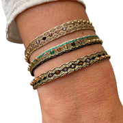      24 14k Gold filled beads     6 Semi Precious stones     Handwoven adjustable bracelet     Width 6mm