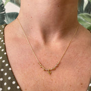 This gorgeus necklace is designed to be layered with other styles from and looks beautiful on its own, too. It's handmade using a 14k gold filled chain, brown Zircon semi-precious stones and a sliced diamond on a vermeil setting as a center piece    14 K gold filled chain and clasp closure Vermeil beads charms Measures 42cm + 2cm extension Handmade necklace
